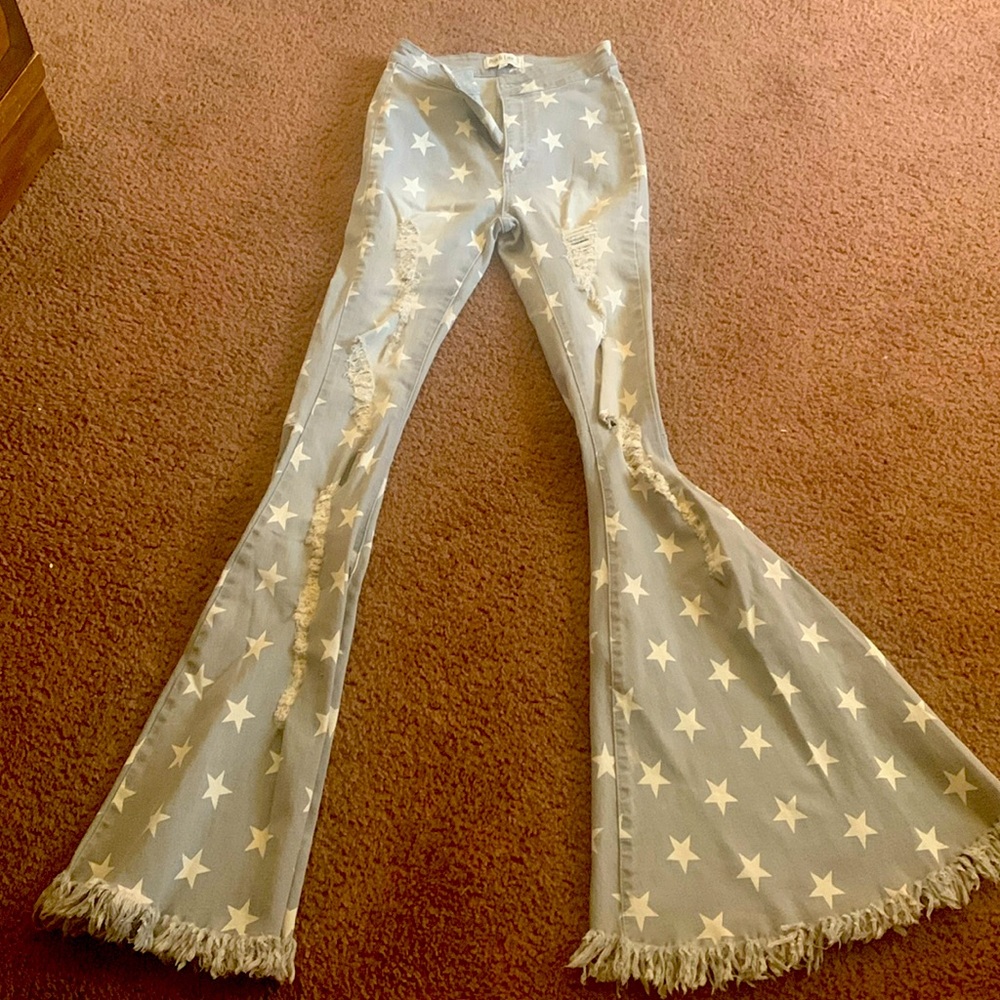 Grey flare jeans with white stars never worn to long